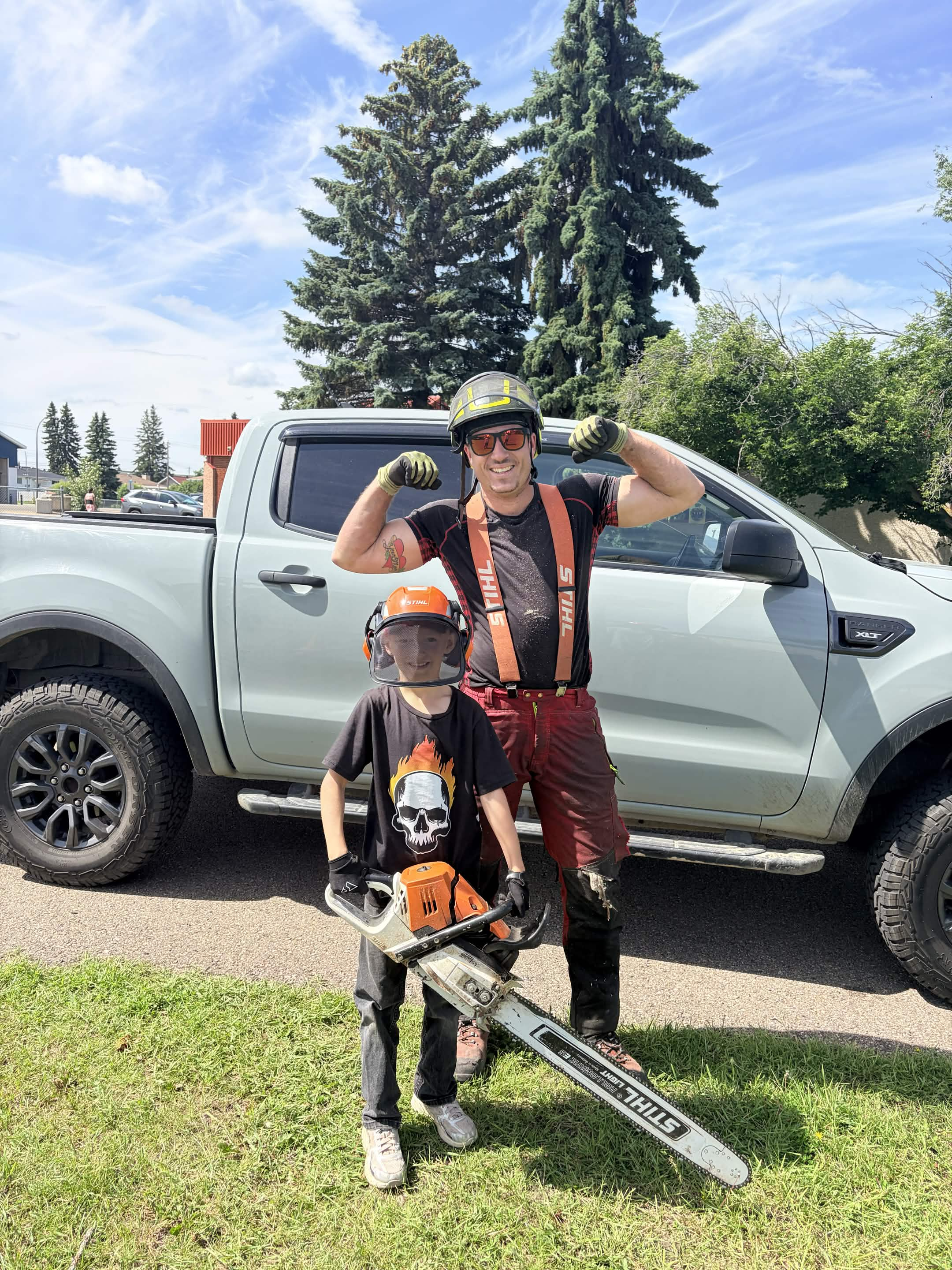 Professional tree climber providing safe tree removal in Central Alberta